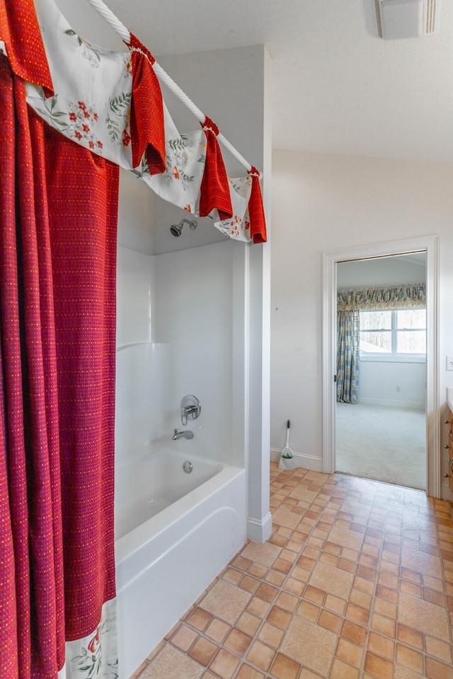 full bath with shower / bath combination with curtain, visible vents, and baseboards