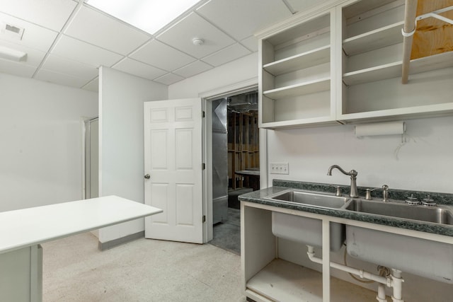 kitchen with a paneled ceiling, visible vents, light floors, and open shelves