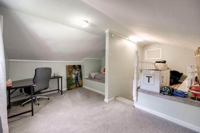 carpeted office with baseboards and vaulted ceiling