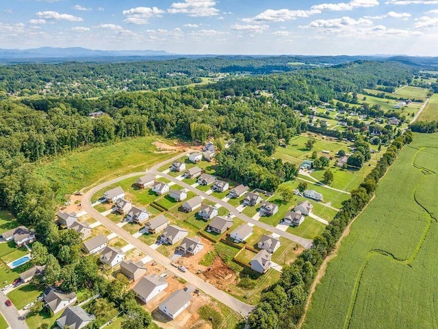 drone / aerial view with a view of trees