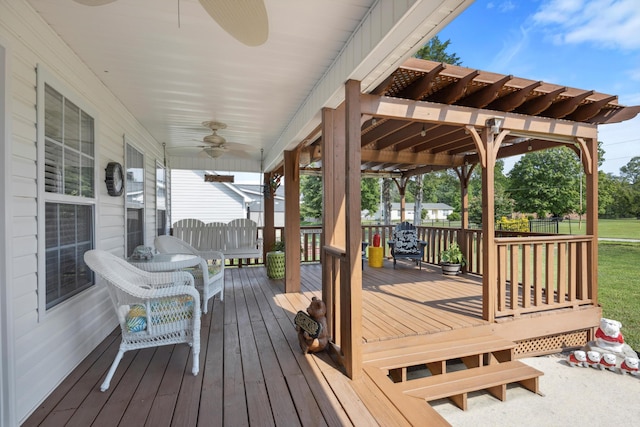 deck with ceiling fan and covered porch