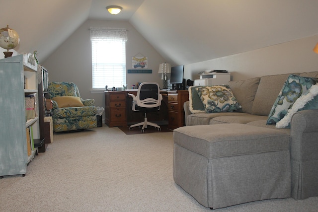 office space with vaulted ceiling and light colored carpet