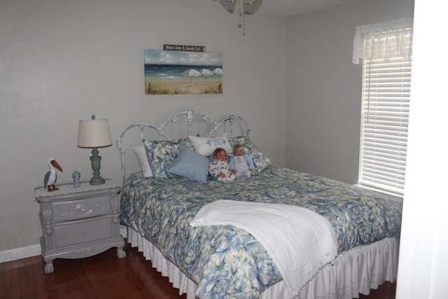 bedroom with wood finished floors