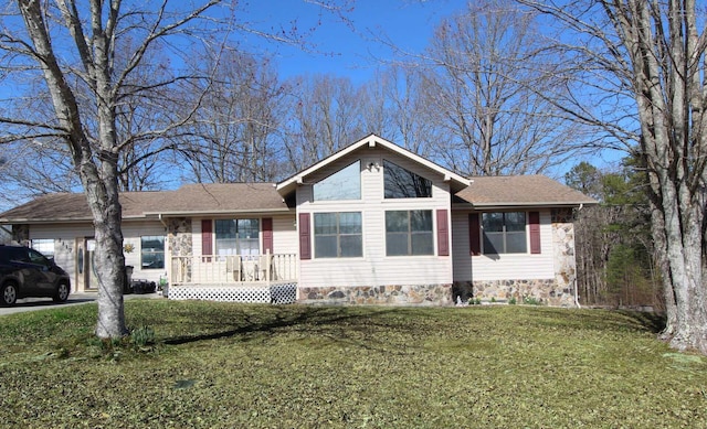 single story home with a garage, driveway, and a front lawn