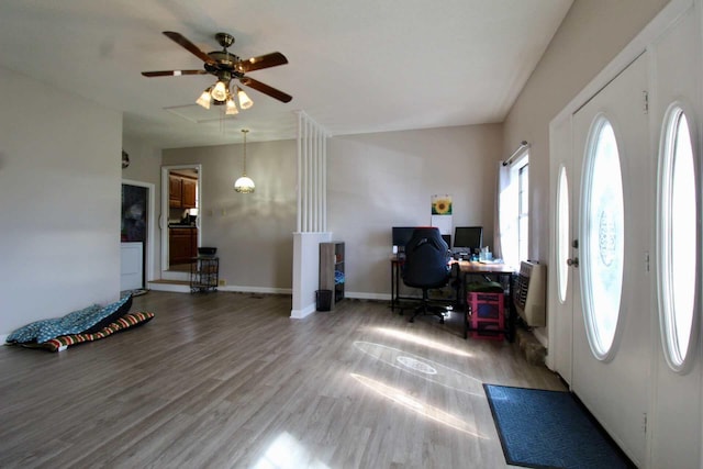 office area featuring ceiling fan, wood finished floors, and baseboards