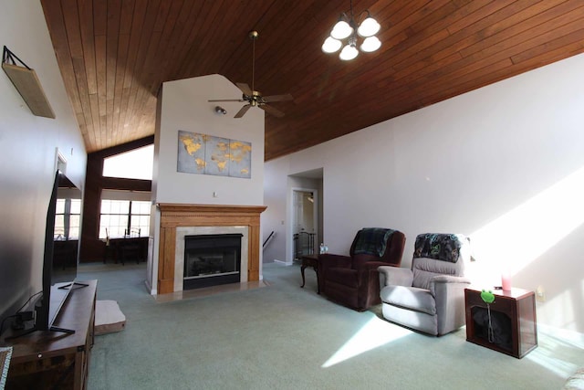 living room with carpet floors, a fireplace with flush hearth, wood ceiling, high vaulted ceiling, and ceiling fan with notable chandelier