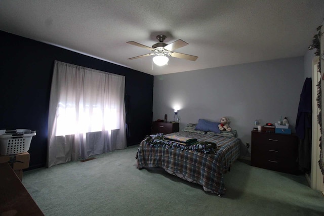 bedroom with carpet and a ceiling fan