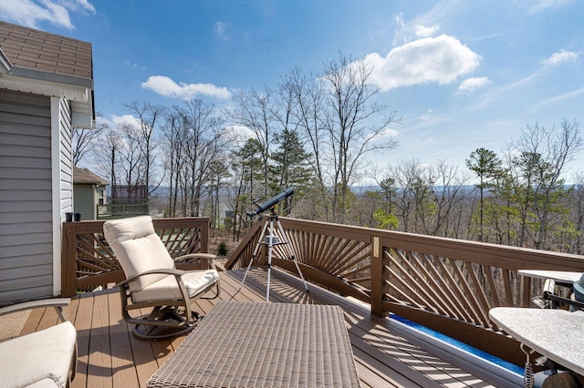 deck with outdoor dining area