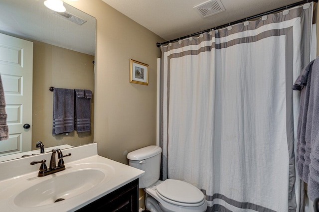 full bath featuring visible vents, toilet, and vanity