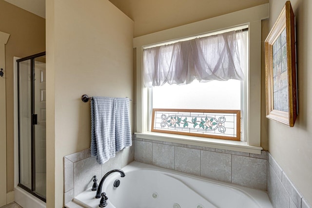 full bathroom with a tub with jets and a shower stall