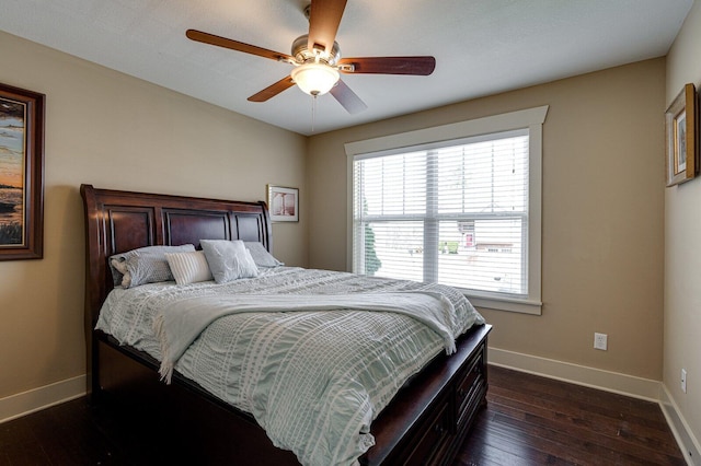 bedroom featuring a ceiling fan, baseboards, and dark wood-style flooring