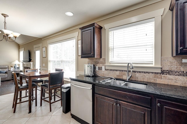 kitchen featuring a sink, dark brown cabinetry, dishwasher, a notable chandelier, and backsplash