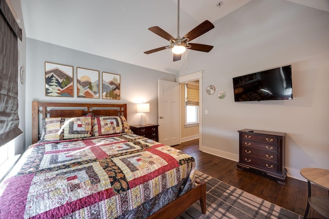 bedroom with lofted ceiling, a ceiling fan, baseboards, and wood finished floors