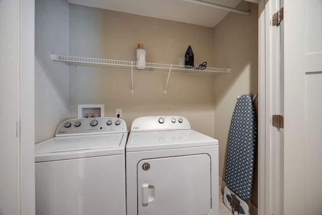 laundry room featuring laundry area and washing machine and dryer