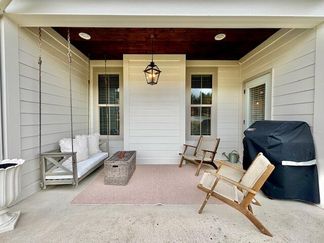 view of patio / terrace featuring a porch and a grill