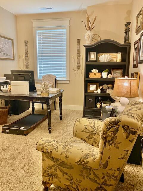 office area featuring visible vents and baseboards