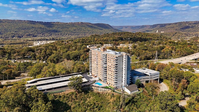 birds eye view of property with a view of trees and a mountain view