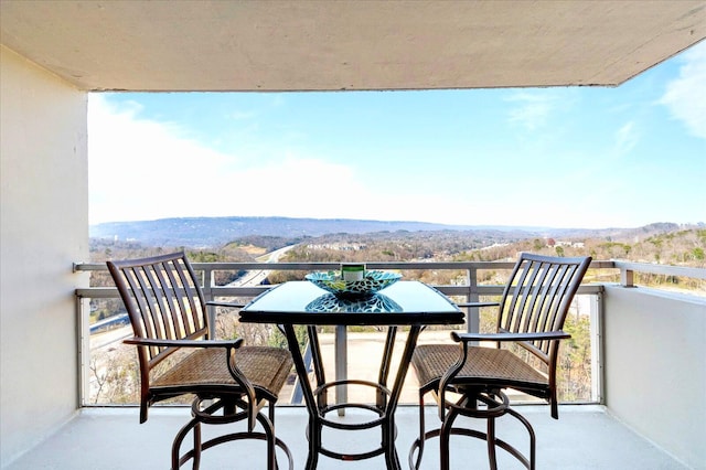 balcony featuring a mountain view