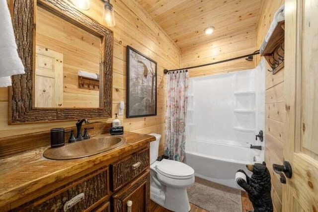 bathroom featuring wooden walls, shower / bath combo with shower curtain, toilet, wooden ceiling, and vanity