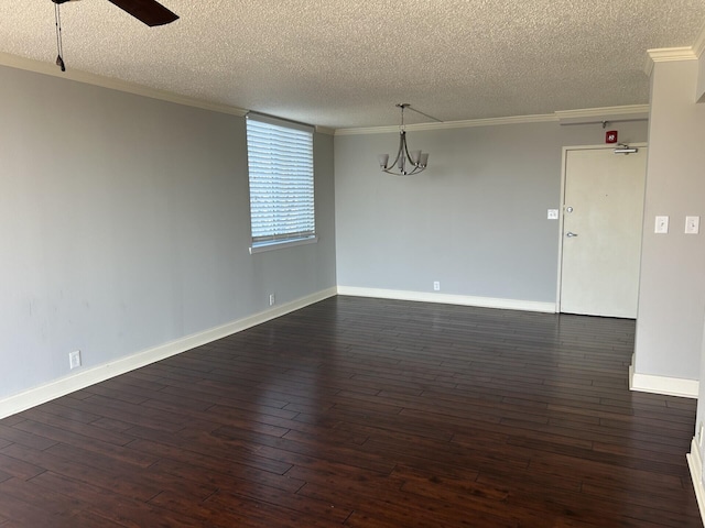 unfurnished room featuring dark wood finished floors, ceiling fan with notable chandelier, crown molding, and baseboards