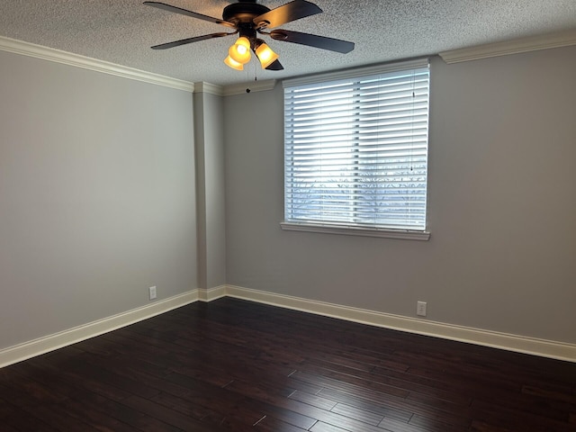 spare room with a textured ceiling, baseboards, and dark wood-style flooring