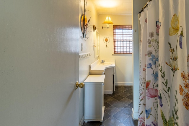 full bathroom with curtained shower, tile patterned flooring, vanity, baseboards, and crown molding