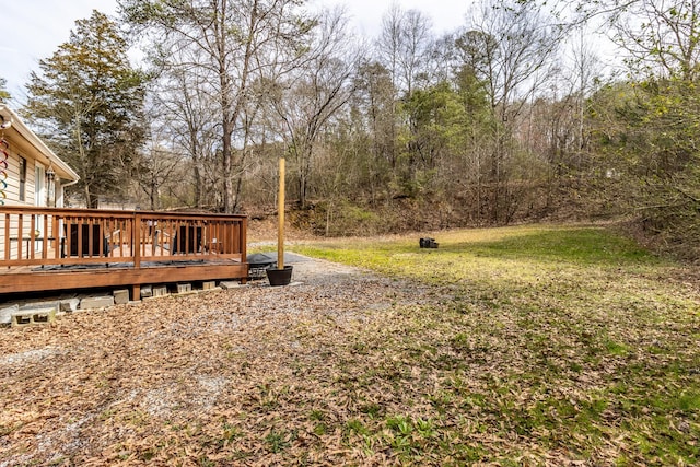 view of yard with a wooden deck