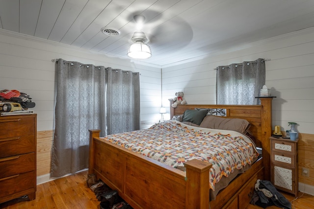 bedroom featuring wooden ceiling, visible vents, and light wood-type flooring