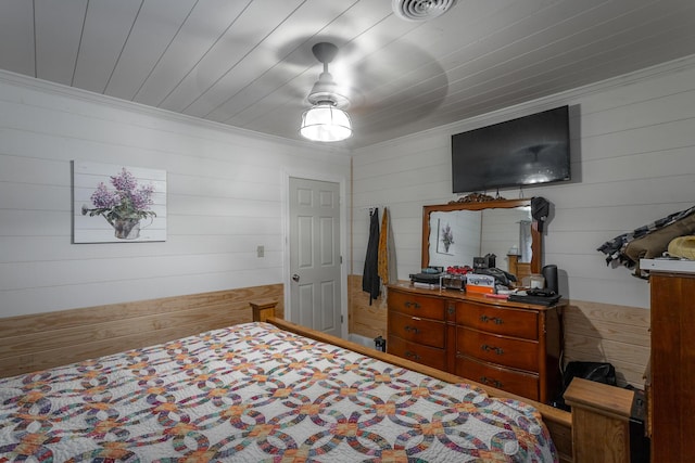 bedroom featuring visible vents, wooden ceiling, and crown molding