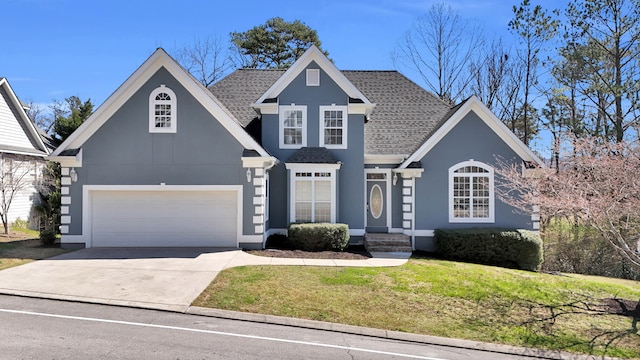 225 Blue Jay Pkwy, Ringgold, GA 30736 - traditional home featuring a shingled roof, concrete driveway, a front lawn, and stucco siding