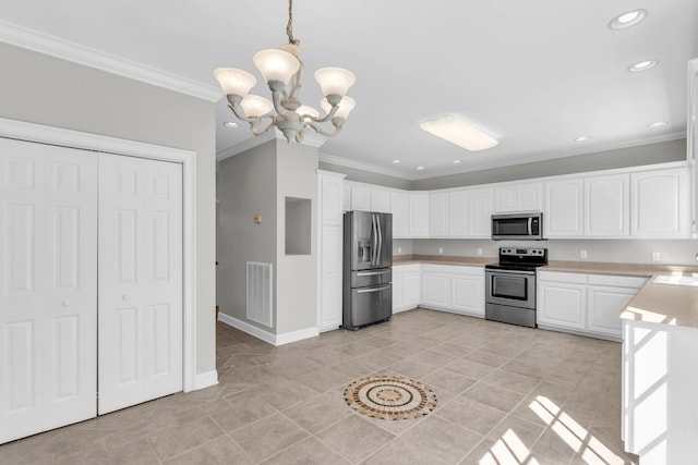 225 Blue Jay Pkwy, Ringgold, GA 30736 - kitchen featuring light countertops, ornamental molding, appliances with stainless steel finishes, a notable chandelier, and white cabinetry