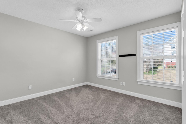 225 Blue Jay Pkwy, Ringgold, GA 30736 - spare room featuring visible vents, baseboards, ceiling fan, dark carpet, and a textured ceiling