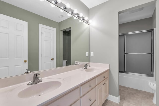 225 Blue Jay Pkwy, Ringgold, GA 30736 - bathroom featuring a sink, toilet, double vanity, and tile patterned flooring