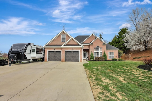 view of front of home with a garage, driveway, brick siding, and a front lawn