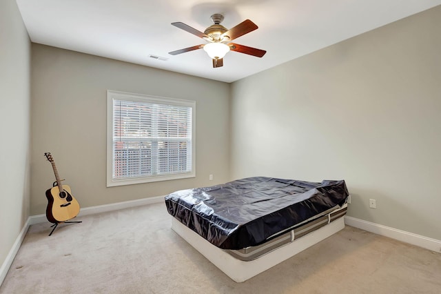 bedroom with visible vents, baseboards, a ceiling fan, and carpet flooring