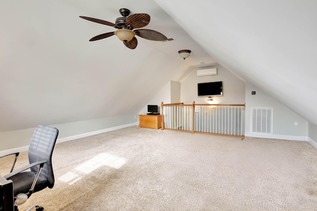 unfurnished office featuring lofted ceiling, carpet flooring, visible vents, and a wall mounted air conditioner