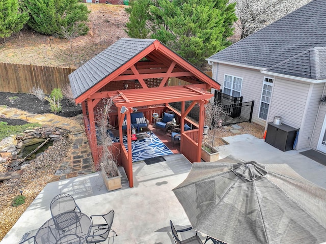 view of patio / terrace with a gazebo, outdoor dining area, and fence