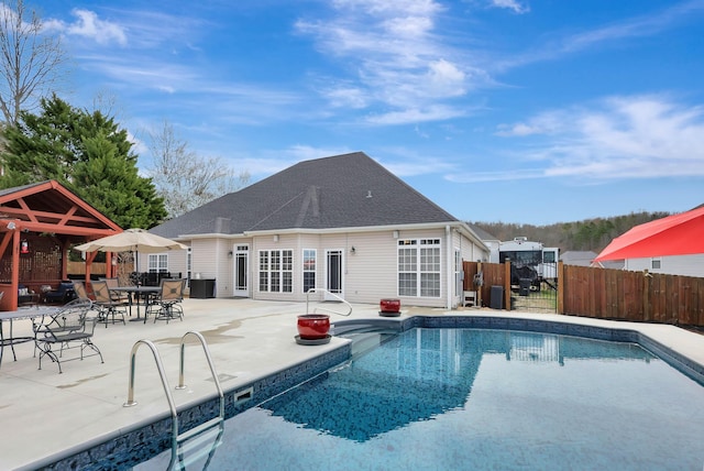 view of pool with a gazebo, a patio, fence, and a fenced in pool