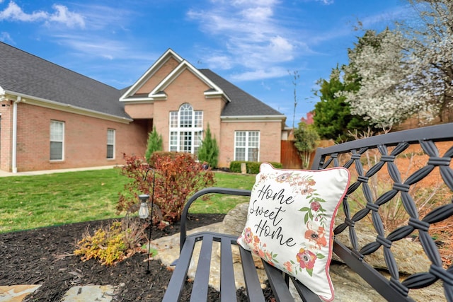 exterior space with a lawn and fence