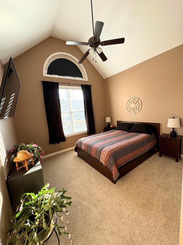 carpeted bedroom with baseboards, a ceiling fan, and vaulted ceiling