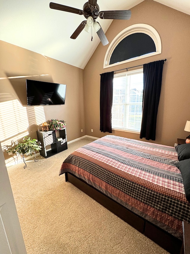 bedroom featuring carpet floors, baseboards, ceiling fan, and vaulted ceiling