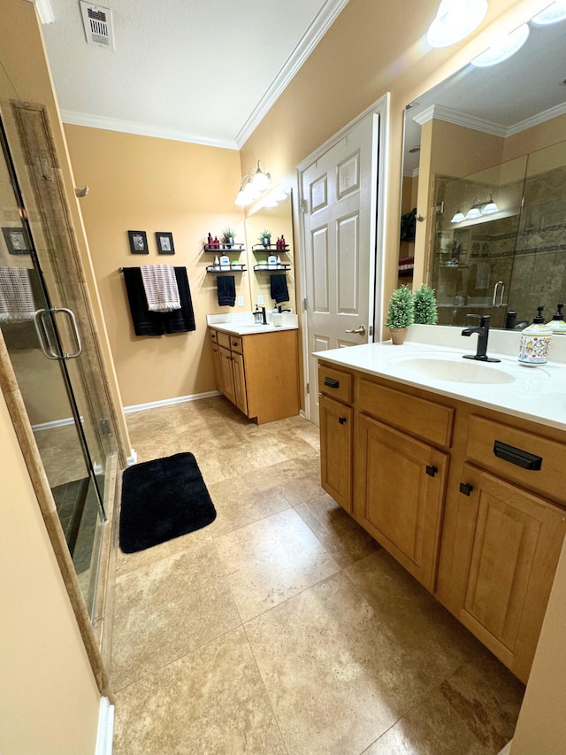 full bathroom with a stall shower, ornamental molding, visible vents, and a sink