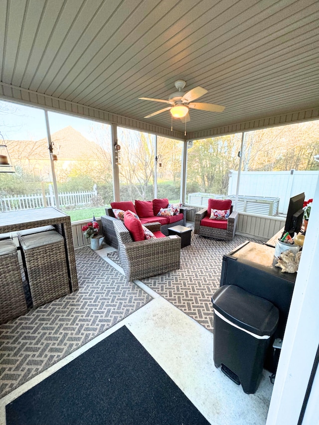 view of patio featuring an outdoor living space, ceiling fan, and fence