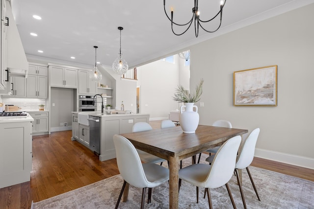1825 River Breeze Dr, Soddy Daisy, TN 37379 - dining space featuring wood finished floors, baseboards, recessed lighting, crown molding, and a notable chandelier