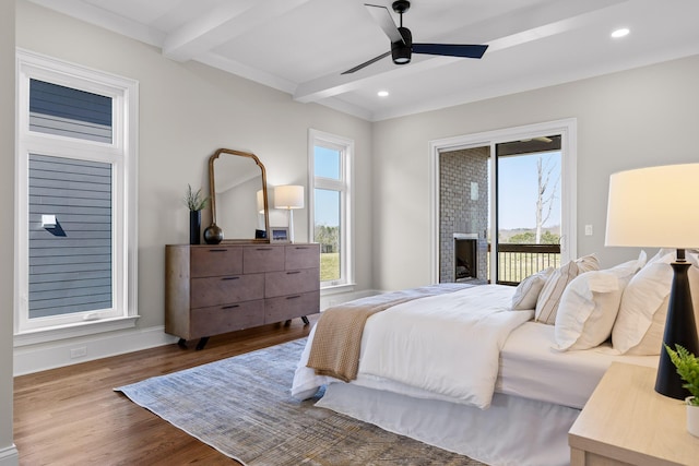 1825 River Breeze Dr, Soddy Daisy, TN 37379 - bedroom with beam ceiling, access to outside, multiple windows, and wood finished floors