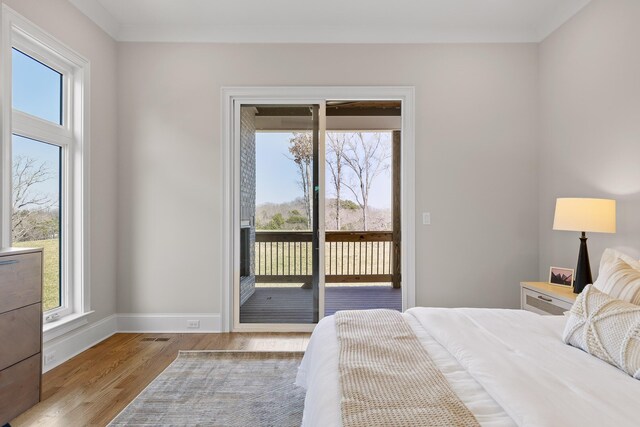 1825 River Breeze Dr, Soddy Daisy, TN 37379 - bedroom featuring access to outside, wood finished floors, and baseboards