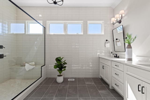 1825 River Breeze Dr, Soddy Daisy, TN 37379 - bathroom featuring a sink, tiled shower, double vanity, and tile patterned flooring