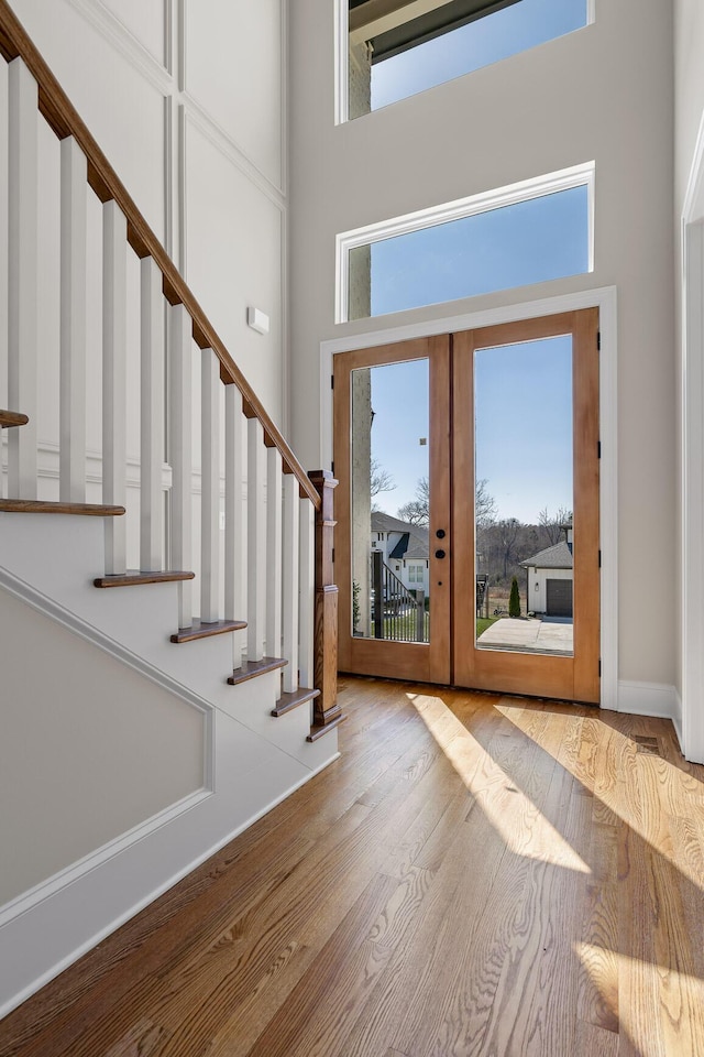 1825 River Breeze Dr, Soddy Daisy, TN 37379 - entryway featuring wood finished floors, french doors, stairway, baseboards, and a towering ceiling