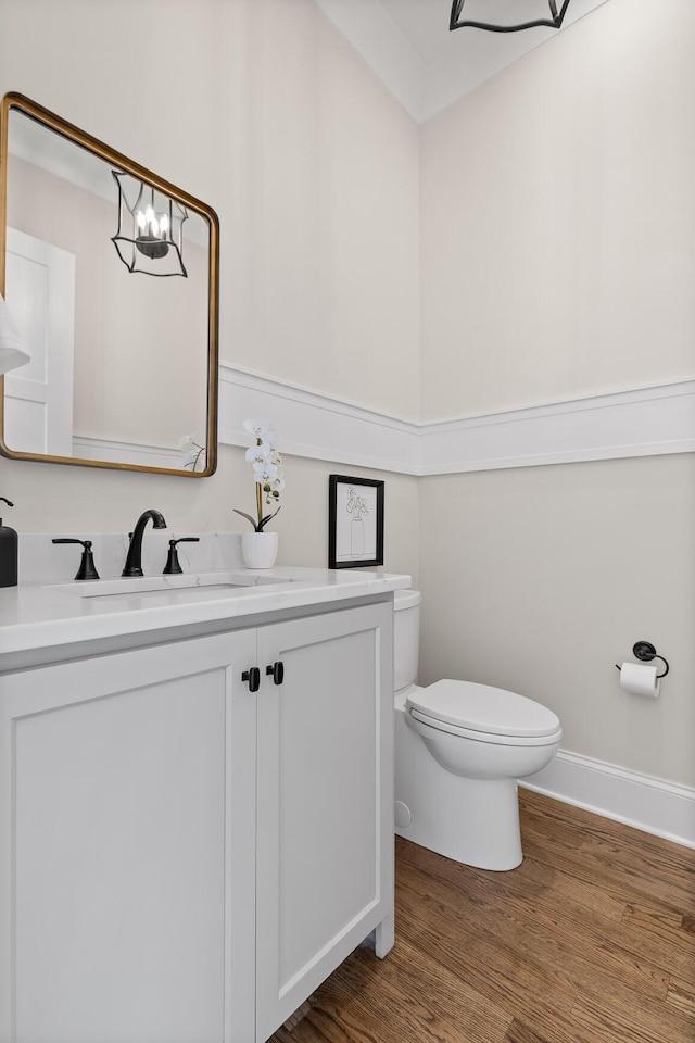1825 River Breeze Dr, Soddy Daisy, TN 37379 - half bathroom with baseboards, toilet, wood finished floors, a notable chandelier, and vanity