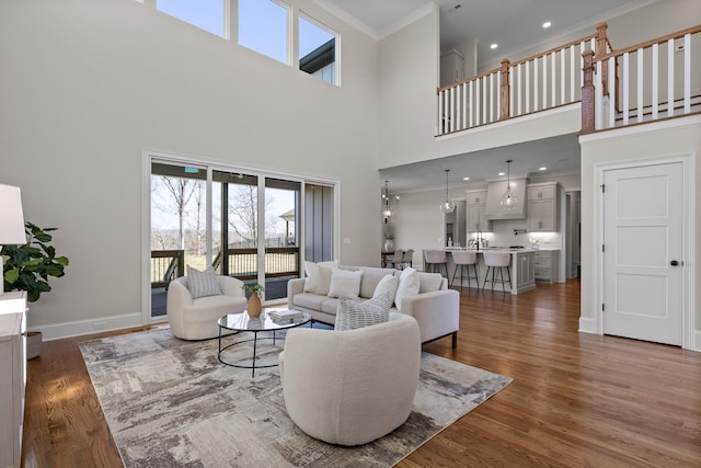 1825 River Breeze Dr, Soddy Daisy, TN 37379 - living area with recessed lighting, wood finished floors, baseboards, and ornamental molding